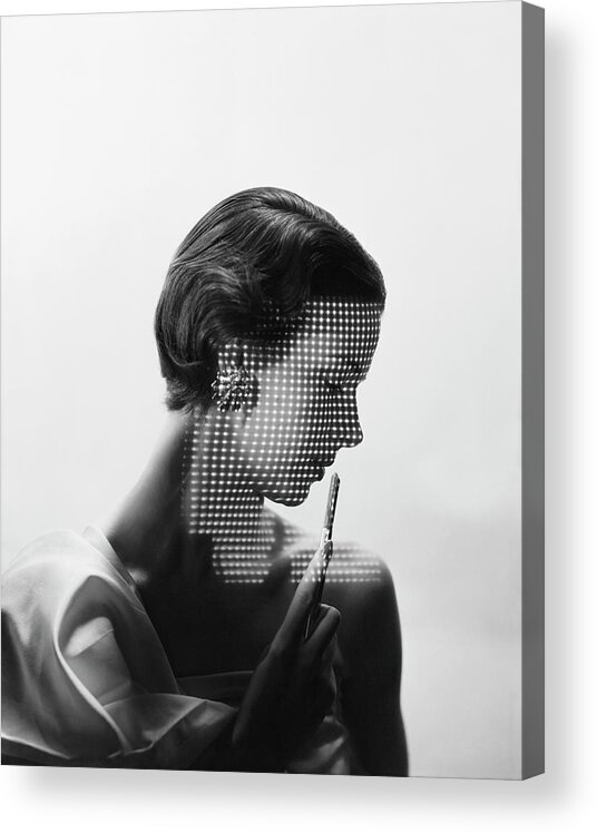 Fashion Acrylic Print featuring the photograph Model With Points of Lights Reflecting Across Her Face by Erwin Blumenfeld