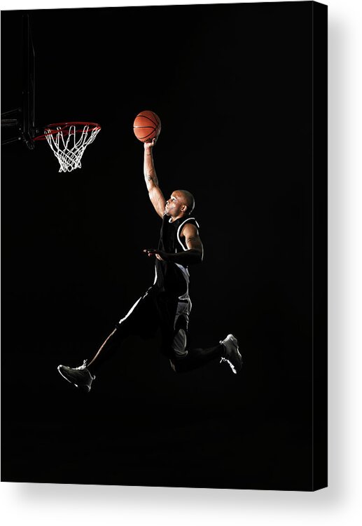 Agility Acrylic Print featuring the photograph Young Man Jumping In Mid Air, Preparing by Thomas Barwick