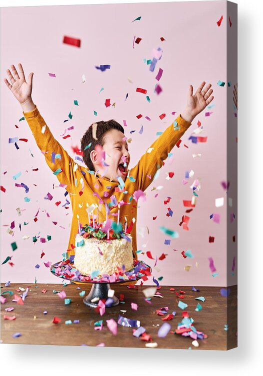 Child Acrylic Print featuring the photograph Cute child on pink background with cake and party confetti. Birthday party and big celebration. by Pinstock