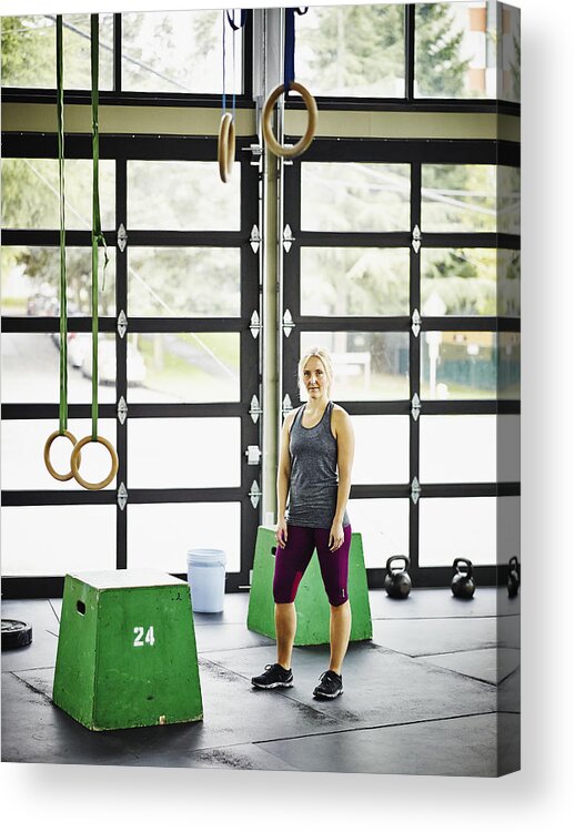 Toughness Acrylic Print featuring the photograph Portrait of woman standing in gym during workout by Thomas Barwick