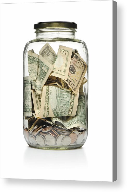 Charity Benefit Acrylic Print featuring the photograph A clear glass jar filled with cash and coins by EasyBuy4u