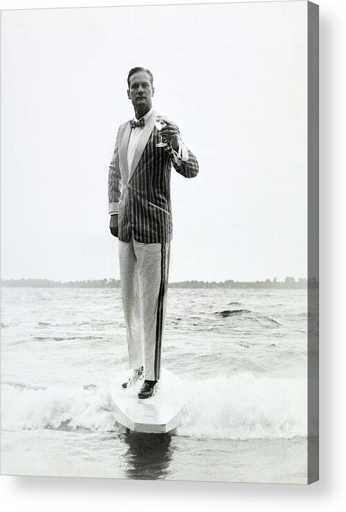 Menswear Acrylic Print featuring the photograph A Model Stands In The Surf In Bronzini by Richard Waite