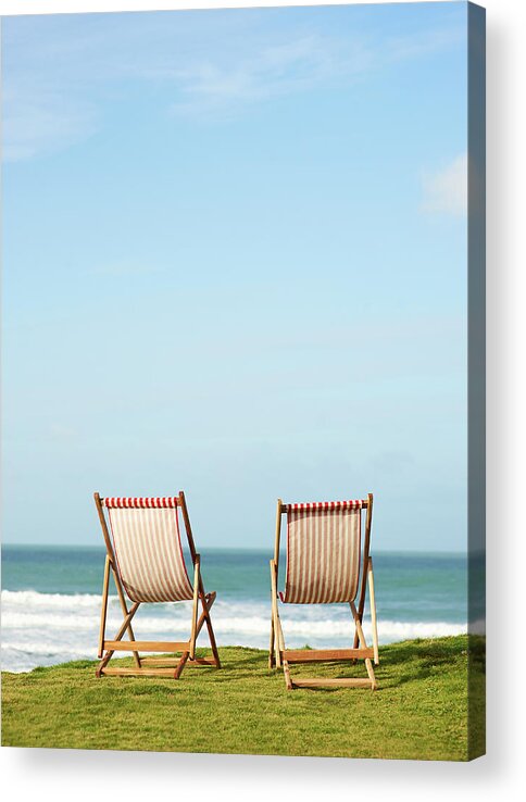 Grass Acrylic Print featuring the photograph Deck Chairs On Coastline Facing Out To by Dougal Waters