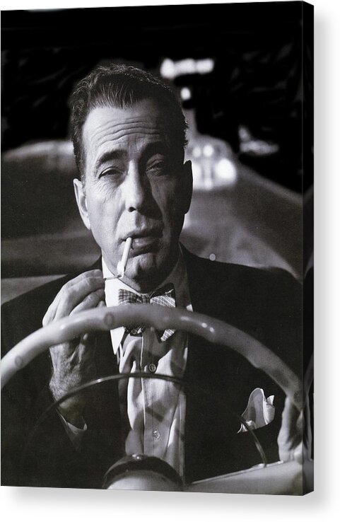 Humphrey Bogart In A Covertable In A Lonely Place 1949 Acrylic Print featuring the photograph Humphrey Bogart in a covertable In A Lonely Place 1949 by David Lee Guss