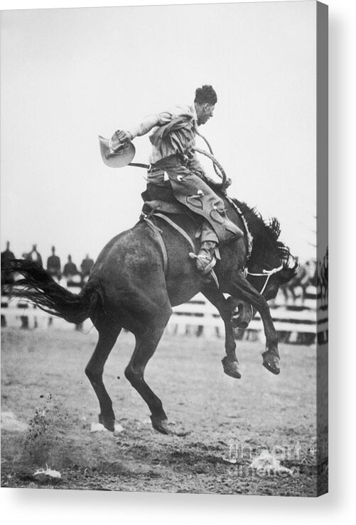 People Acrylic Print featuring the photograph Cowboy Riding Horse In Rodeo by Bettmann