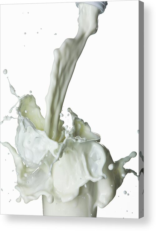Milk Acrylic Print featuring the photograph Milk Splashing Into Glass by Walter Zerla