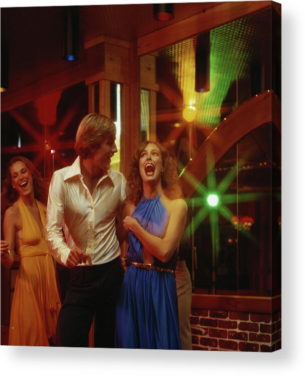 Young Men Acrylic Print featuring the photograph Couples Dancing Together At Nightclub by Tom Kelley Archive