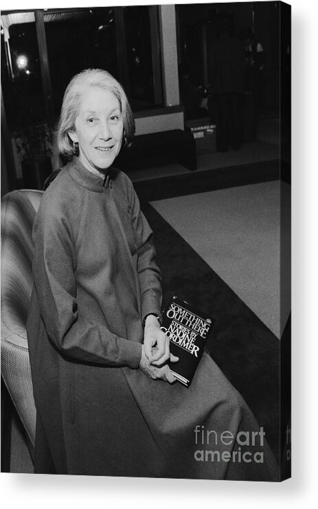 1980-1989 Acrylic Print featuring the photograph Author Nadine Gordimer Holding Her Book by Bettmann