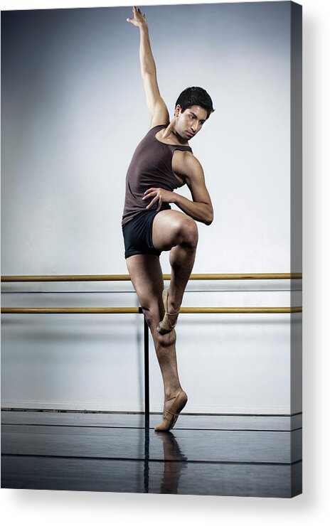 Ballet Dancer Acrylic Print featuring the photograph Ballet Dancer Extending Arm While by Patrik Giardino