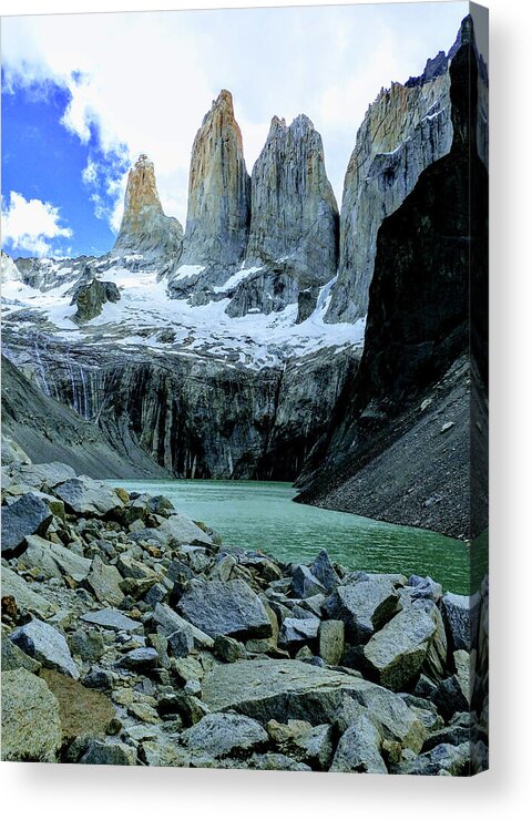 Torres Del Paine National Park Acrylic Print featuring the photograph The rugged windswept Towers over turquoise glacial water by Leslie Struxness