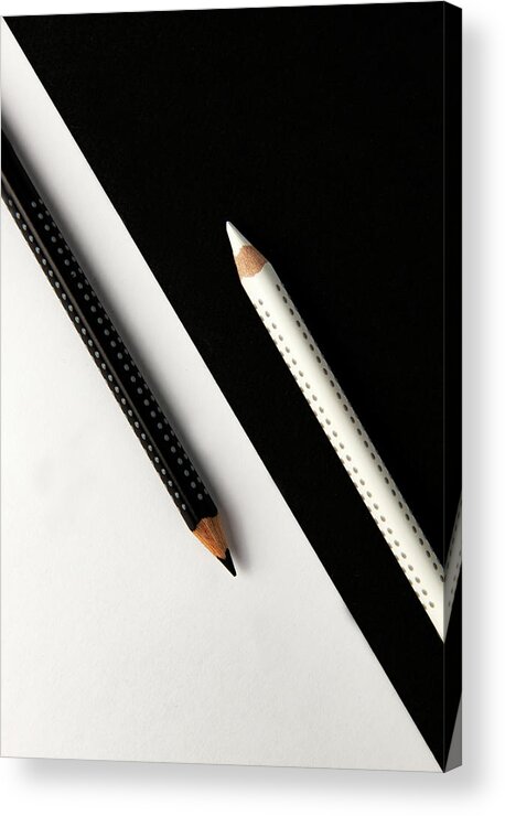 Pencil Acrylic Print featuring the photograph Two drawing pencils on a black and white surface. by Michalakis Ppalis