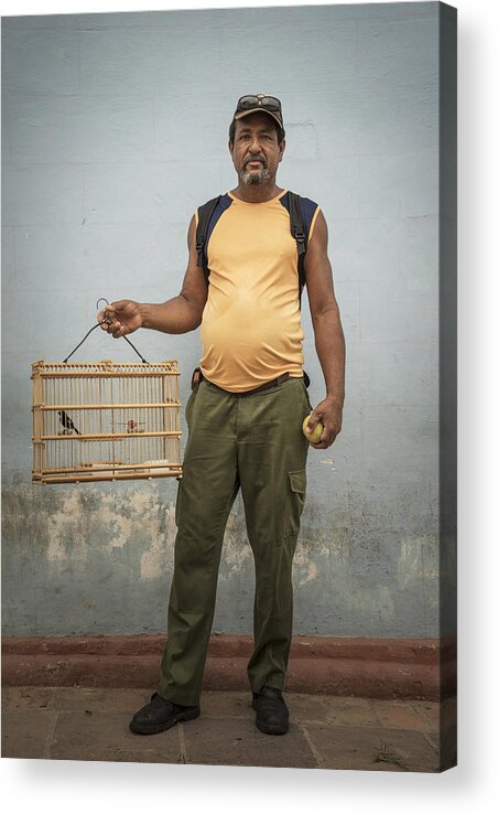 Pets Acrylic Print featuring the photograph Man carrying caged pet bird by Buena Vista Images