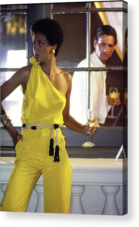 Fashion Acrylic Print featuring the photograph Peggy Dillard Wearing A Yellow One Shoulder Jumpsuit by Guy Le Baube