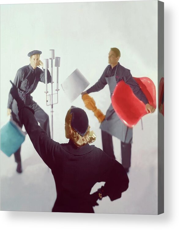Home Accessories Acrylic Print featuring the photograph A Woman Directing Two Men With Props by Horst P. Horst