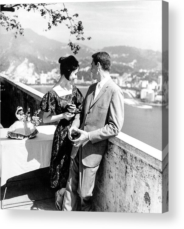 Rio De Janeiro Acrylic Print featuring the photograph Models Holding Wine On A Balcony by Richard Waite