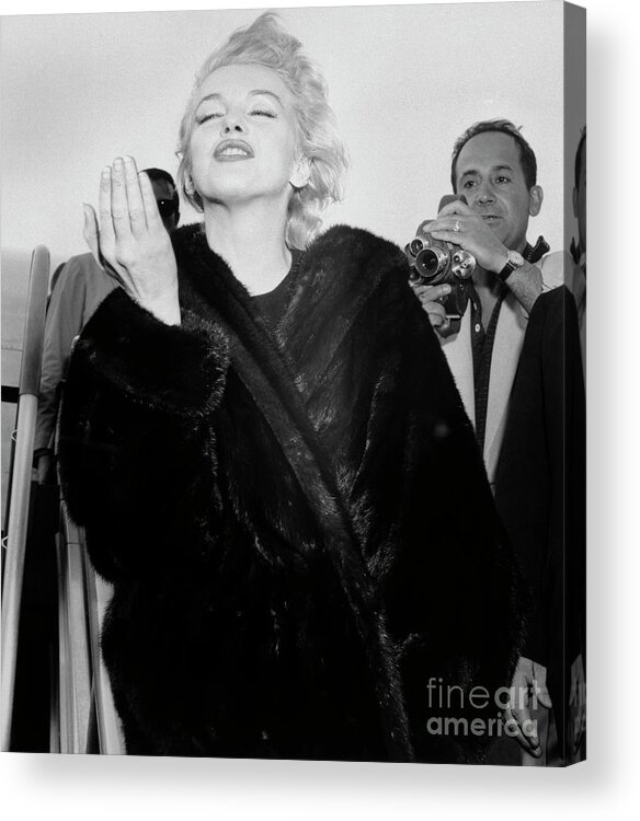 People Acrylic Print featuring the photograph Marilyn Monroe Throws A Kiss At Airport by Bettmann