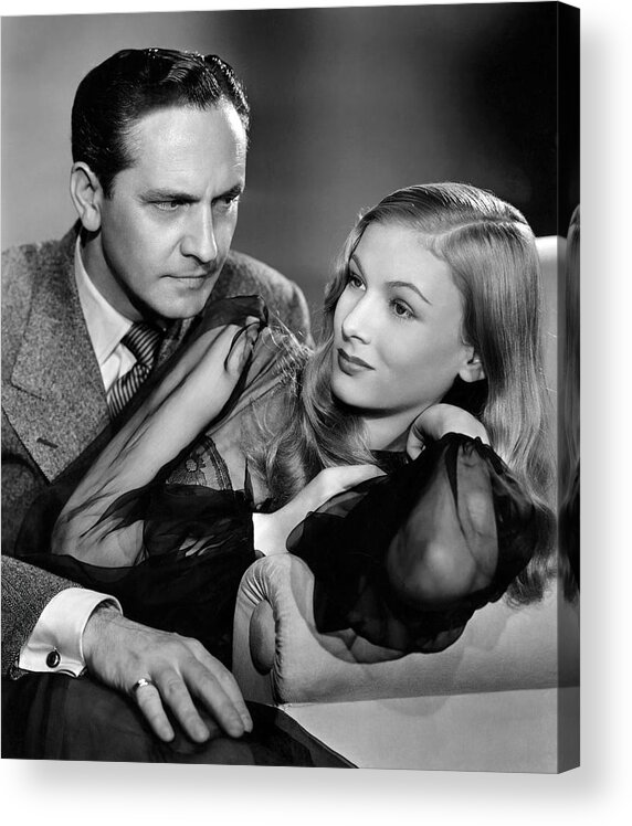 Fredric March Acrylic Print featuring the photograph FREDRIC MARCH and VERONICA LAKE in I MARRIED A WITCH -1942-, directed by RENE CLAIR. by Album