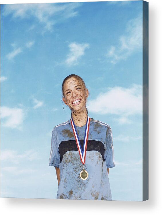 25-29 Years Acrylic Print featuring the photograph Smiling Mud Splattered Sportswoman Wearing a Gold Medal by John Slater
