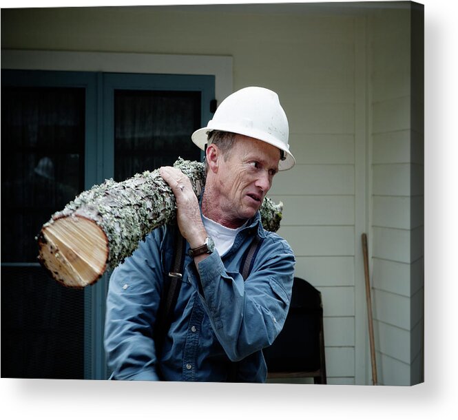 45-49 Years Acrylic Print featuring the photograph A Man Wearing A Hard Hat Carries by Ron Koeberer