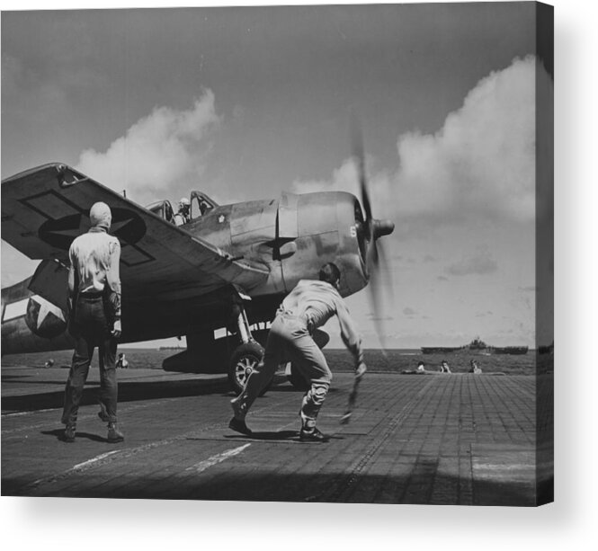 Plane Acrylic Print featuring the photograph A US Navy Fighter Pilot Gets The Take Off Flag From The Deck Crew Of An Aircraft Carrier by American School