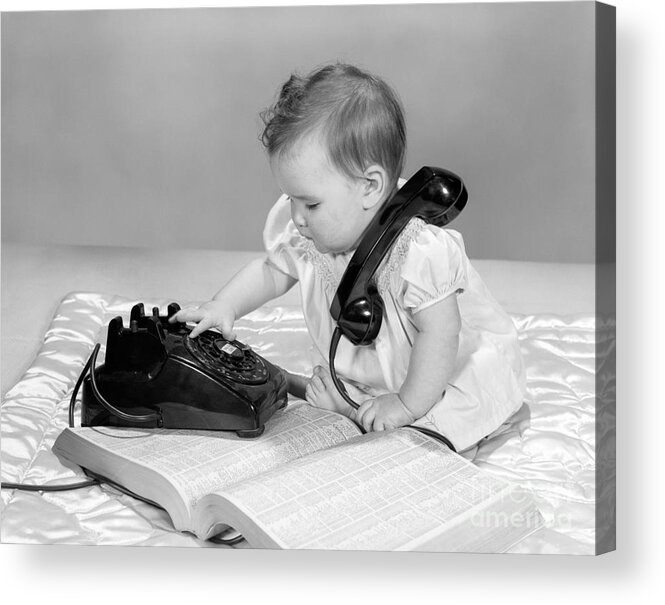 1950s Acrylic Print featuring the photograph Baby With Phonebook And Phone, 1960s by H. Armstrong Roberts/ClassicStock
