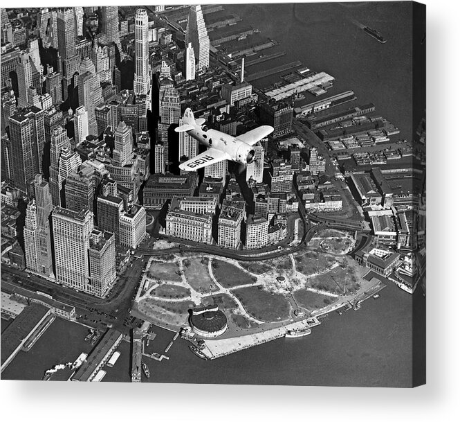 1930's Acrylic Print featuring the photograph Hawk's Plane Over Battery Park by Underwood Archives