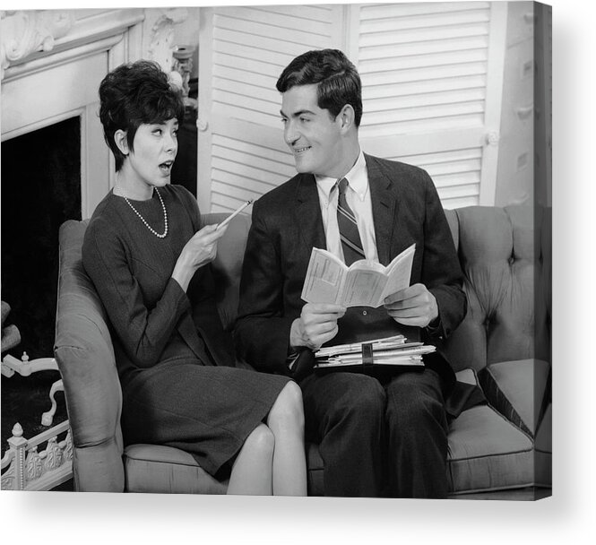 Heterosexual Couple Acrylic Print featuring the photograph Couple Indoor Looking At Travel by George Marks