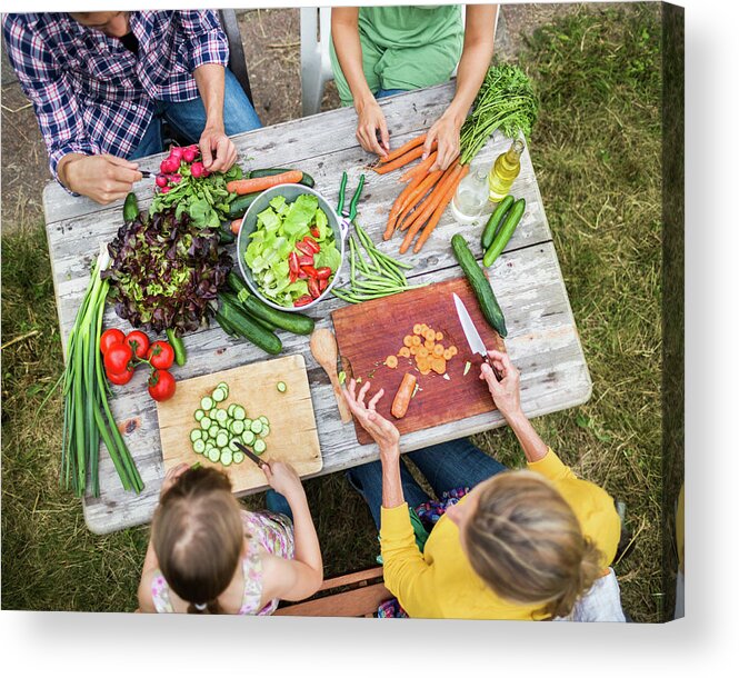 Orange Color Acrylic Print featuring the photograph Family Preparing Salad In Garden by Hinterhaus Productions