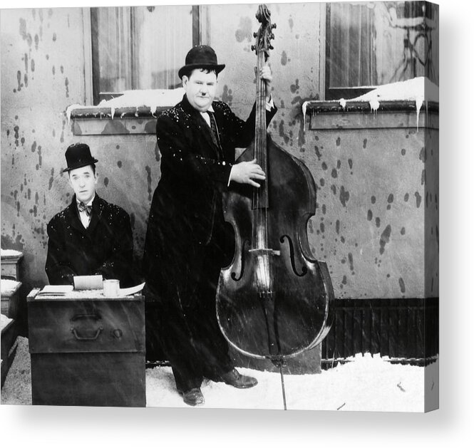 Oliver Hardy Acrylic Print featuring the photograph OLIVER HARDY and STAN LAUREL in BELOW ZERO -1930-. by Album
