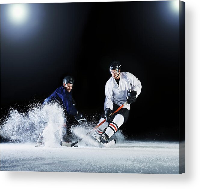 Young Men Acrylic Print featuring the photograph Two Ice Hockey Players Challenging For by Robert Decelis Ltd