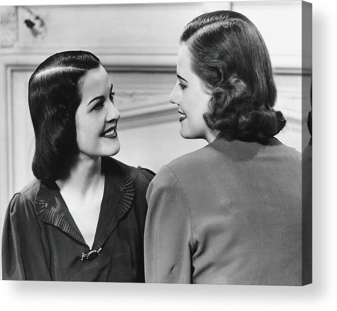 People Acrylic Print featuring the photograph Two Women Conversing In Living Room, B&w by George Marks