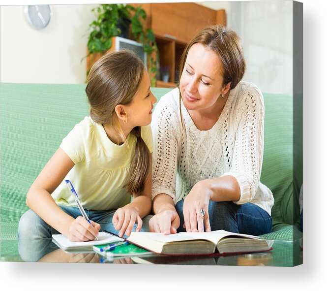 Domestic Room Acrylic Print featuring the photograph Mother with daughter doing homework by JackF