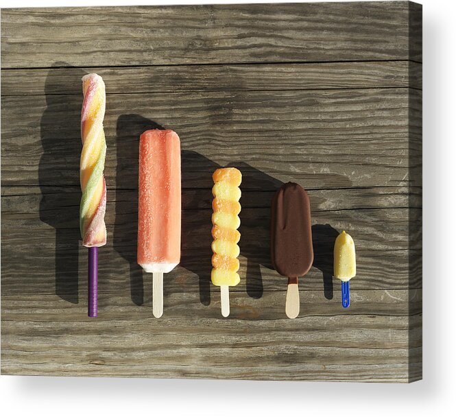In A Row Acrylic Print featuring the photograph Row of assorted ice cream lollies by Henrik Sorensen