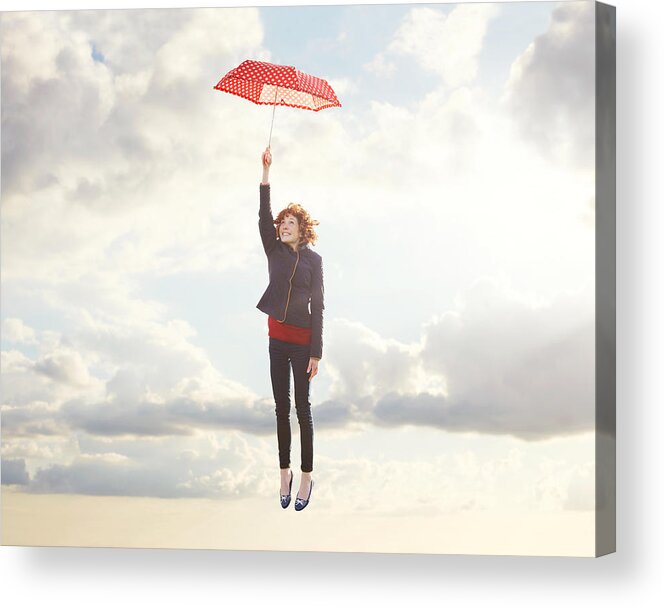 Frome Acrylic Print featuring the photograph Young woman flying with umbrella. by Tim Robberts
