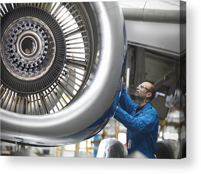 Expertise Acrylic Print featuring the photograph Aircraft engineer working on 737 jet engine in airport by Monty Rakusen