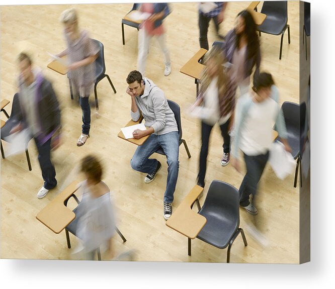 Young Men Acrylic Print featuring the photograph College students moving around man at desk in classroom by Chris Ryan