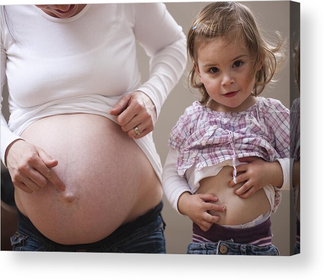 Mid Adult Women Acrylic Print featuring the photograph Girl and pregnant mothers bellies by Cultura RM Exclusive/Judith Wagner Fotografie