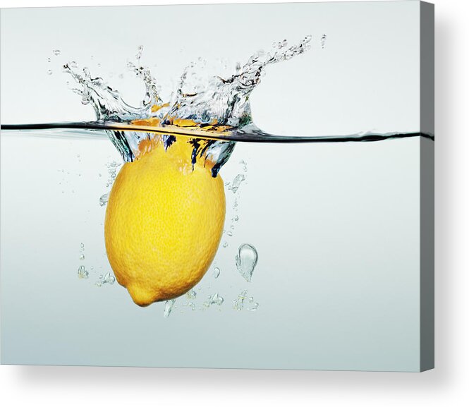 Underwater Acrylic Print featuring the photograph Lemon splashing in water by Martin Barraud