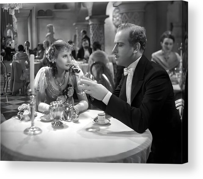 #barbara_stanwyck Acrylic Print featuring the photograph Barbara Stanwyck And Melvyn Douglas Sitting At Table by Globe Photos