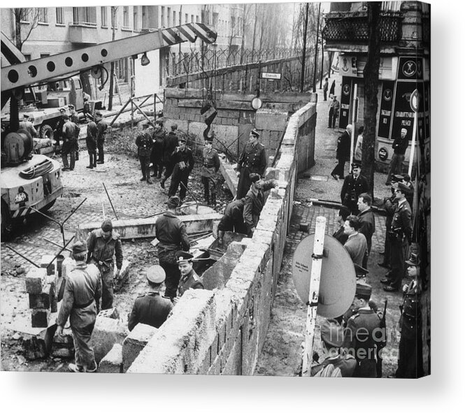 People Acrylic Print featuring the photograph East Berlin Policemen Repairing Wall by Bettmann