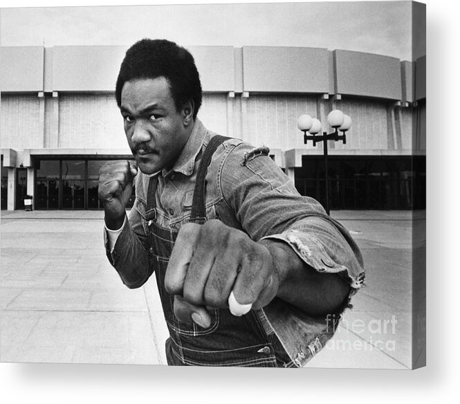 Joe Frazier Acrylic Print featuring the photograph George Foreman In Fight Pose At Nassau by Bettmann