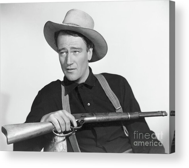 Rifle Acrylic Print featuring the photograph John Wayne Seated With Rifle by Bettmann