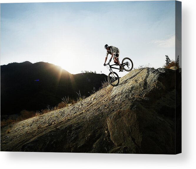 Mature Adult Acrylic Print featuring the photograph Mountain Biker Descending On Slick Rock by Thomas Barwick