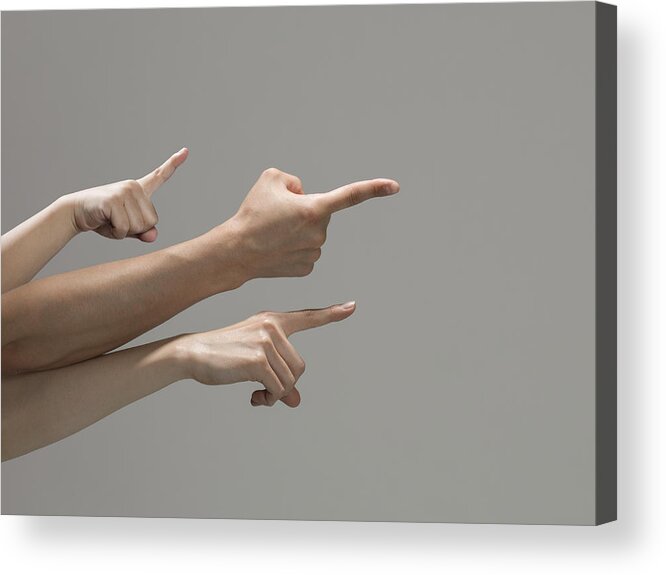 Teamwork Acrylic Print featuring the photograph Three arms pointing at the same direction. by Kokouu