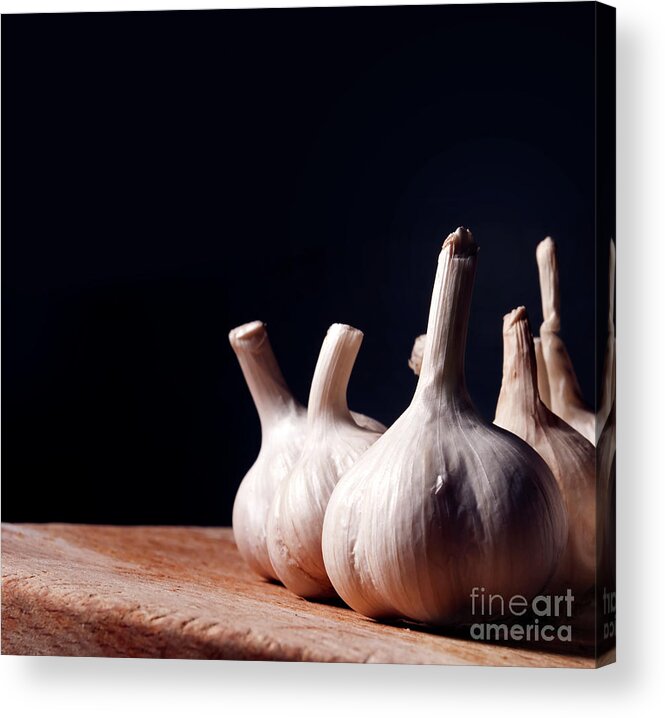 Garlic Acrylic Print featuring the photograph Garlic bulbs on wooden table by Jelena Jovanovic
