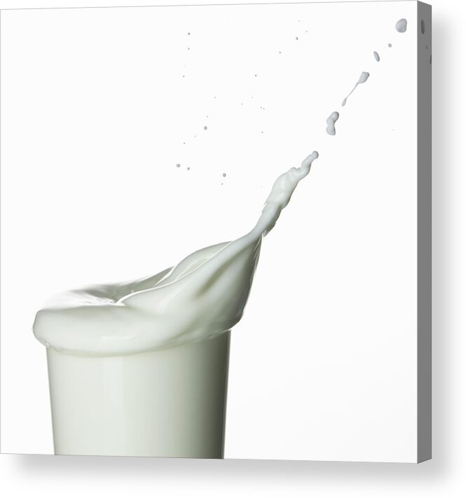Milk Acrylic Print featuring the photograph Milk Splashing Into Glass #1 by Walter Zerla