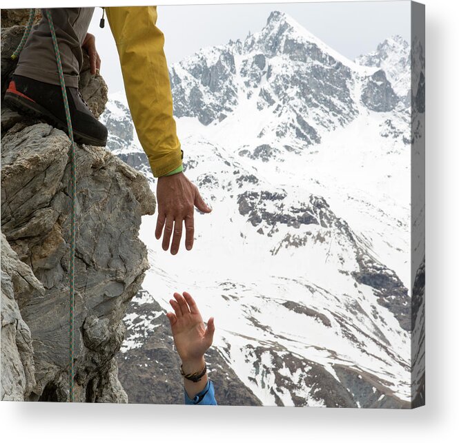 Young Men Acrylic Print featuring the photograph Climber Offers Teammate A Helping Hand by Ascent Xmedia