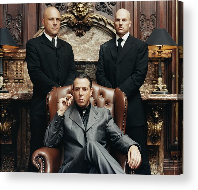 Smoking Acrylic Print featuring the photograph Wealthy Criminal Sitting in an Armchair Between two Bodyguards by Digital Vision.