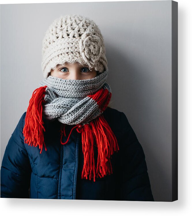 Child Acrylic Print featuring the photograph Girl warmly wrapped up in woollen hat and scarf by Hugh Whitaker