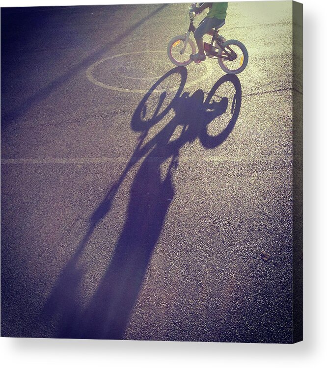 Shadow Acrylic Print featuring the photograph Long Shadow Of Child Riding A Bicycle by Jodie Griggs